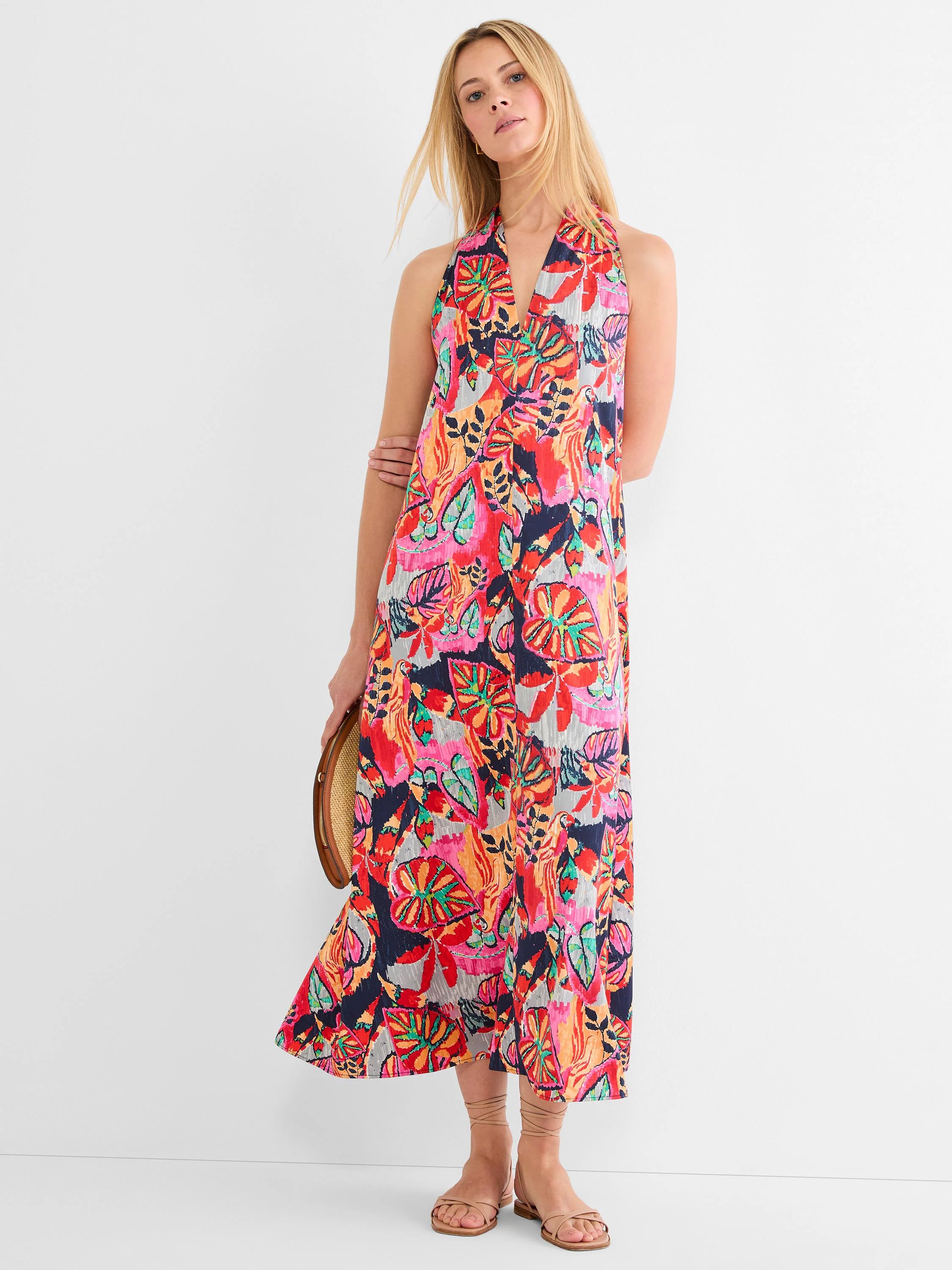 Halter neck maxi dress with a vibrant, abstract print in navy, red, pink, orange, teal, and gray colors.