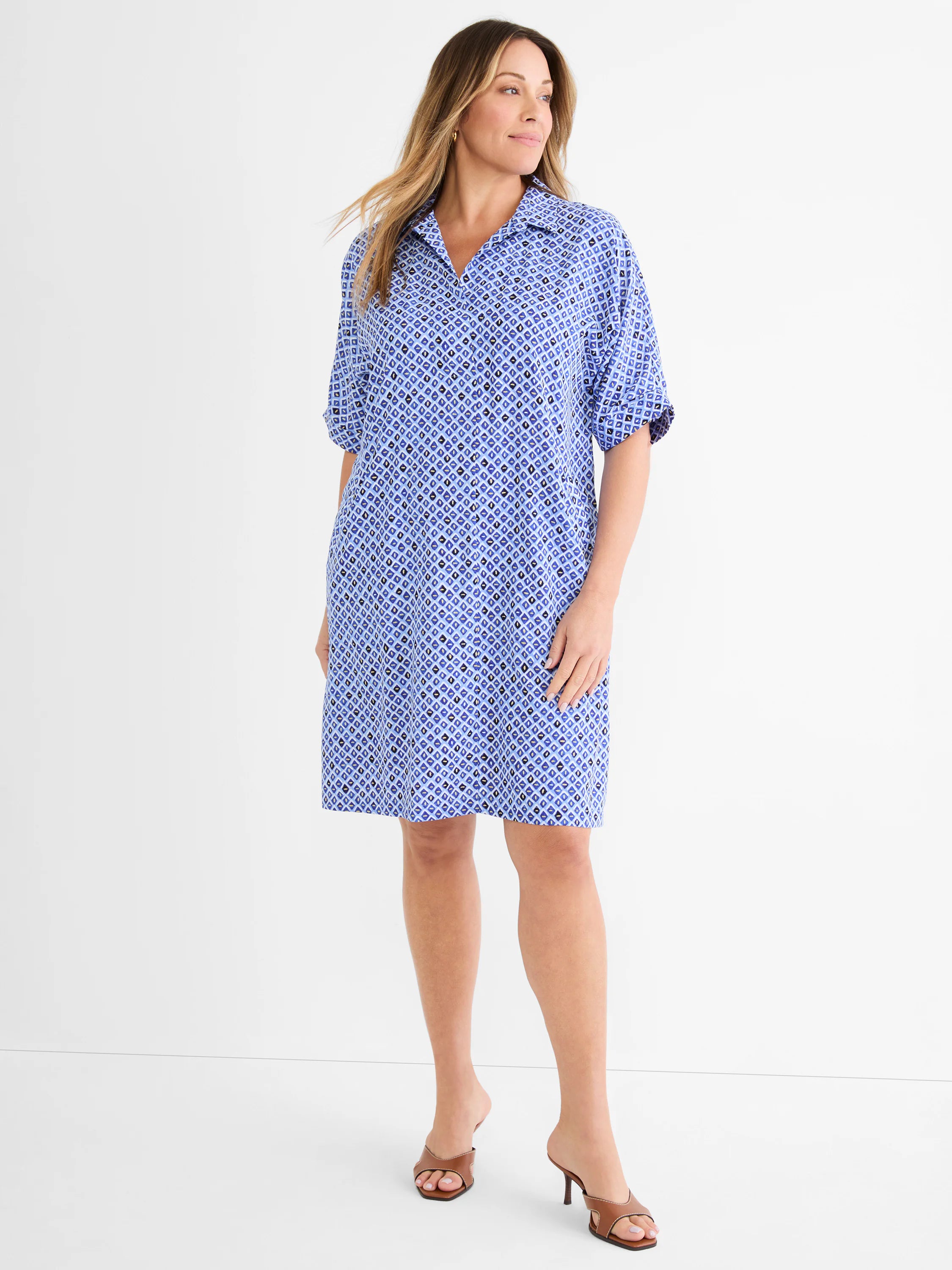 Blue and black mosaic pattern dress, collared V-neck, cuffed short sleeves, knee-length.