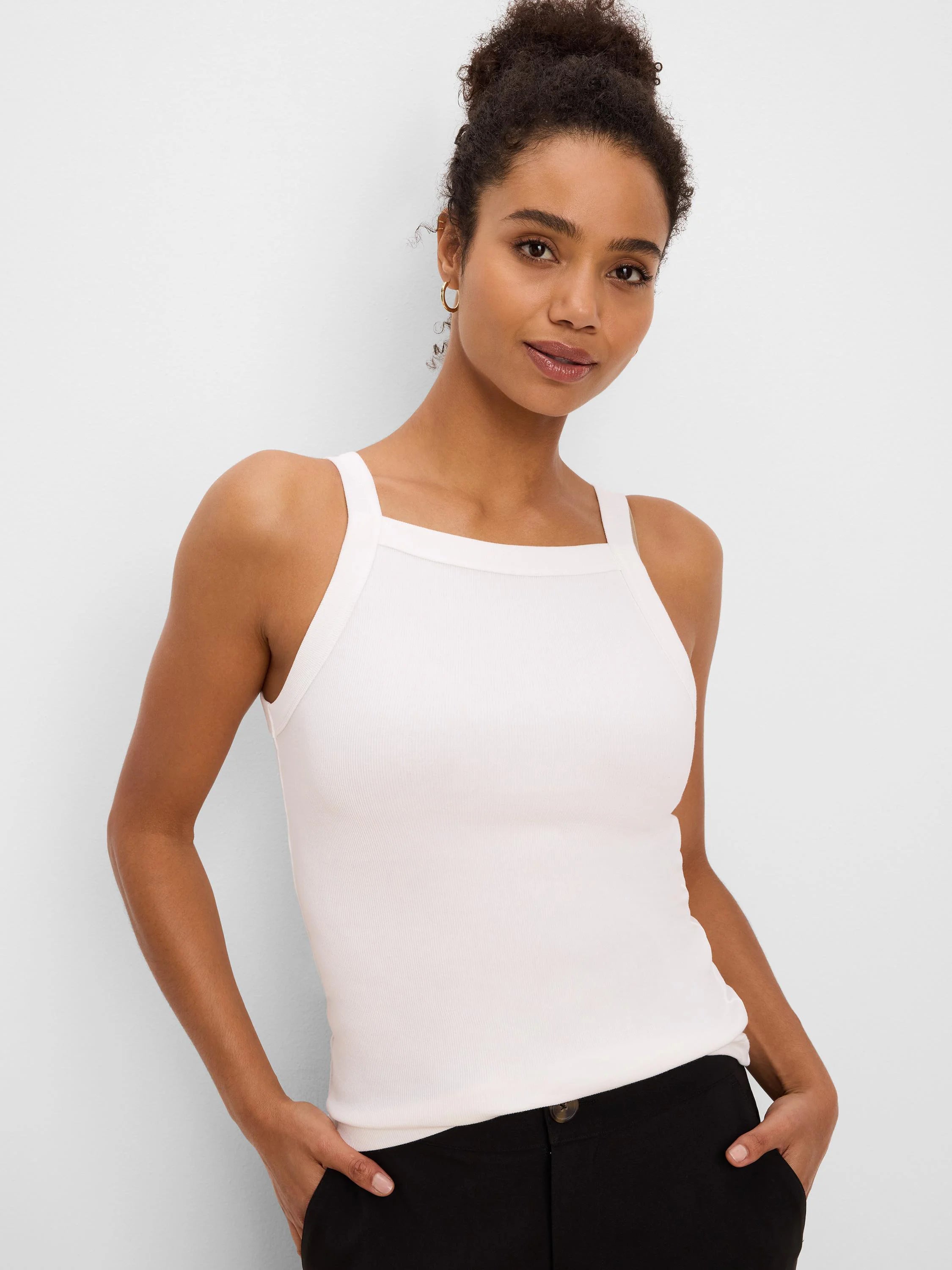 Off-white ribbed tank with a square neck, wide straps, and a form-fitting silhouette.