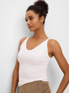 Fitted off-white ribbed V-neck tank top.