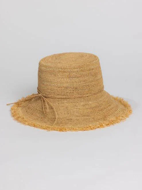 Natural tan woven raffia bucket hat with a wide, frayed brim and a thin tie around the crown.