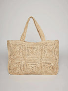Beige crochet tote bag.  Large, square, circular patterns.  Two top handles.