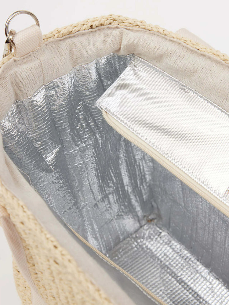 Beige straw tote bag with cream fabric lining.  Features a silver insulated interior compartment with zipper.