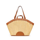 Hammitt Shelly Tote: Tan woven straw, fan-shaped body, brown leather trim, handles & half-circle base accent, silver studs.