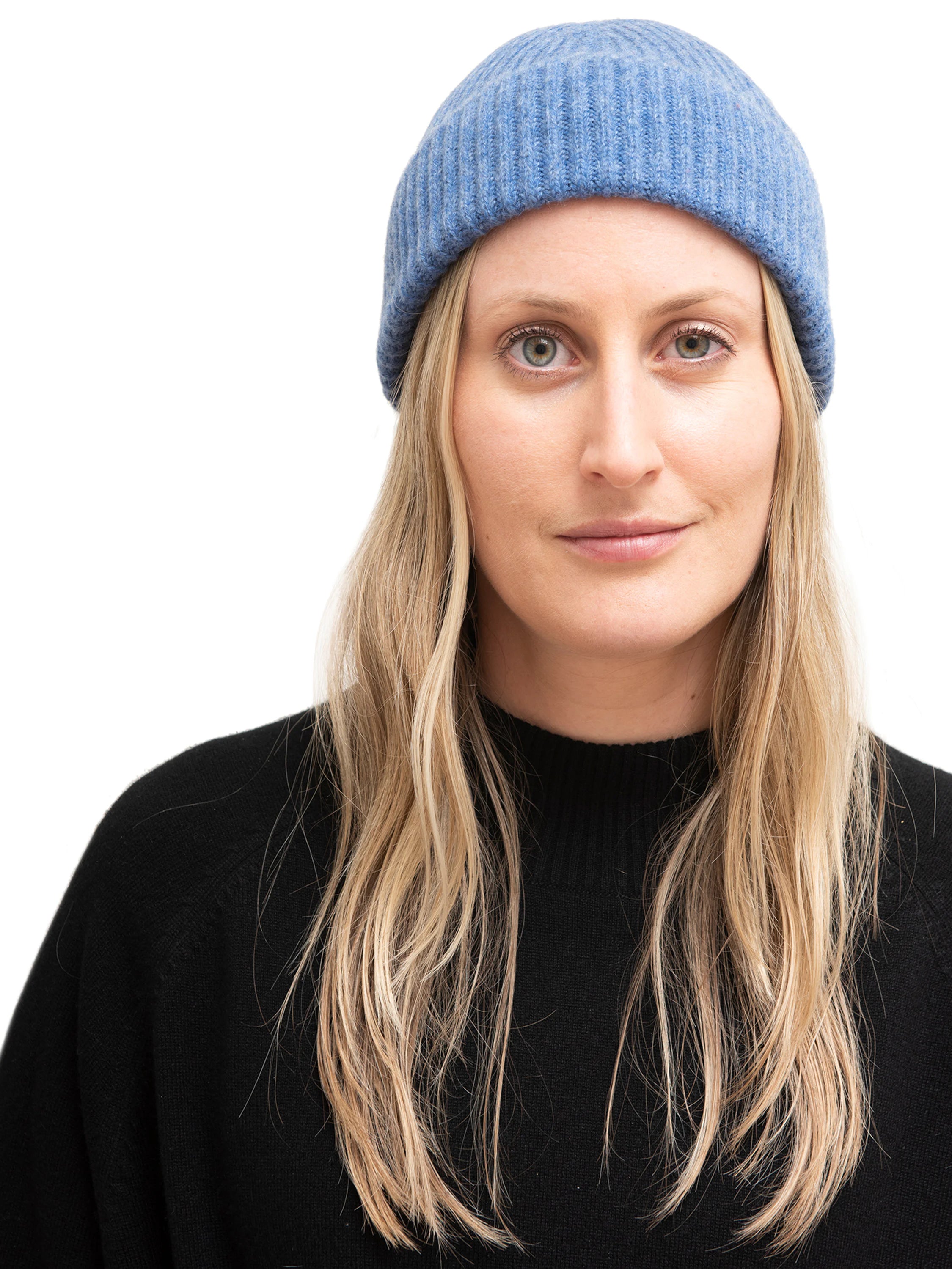 Here's alt text for the image, under 125 characters:

"Blue ribbed cashmere beanie.  Woman with blonde hair models it...