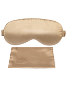 Contoured light gold silk sleep mask with elastic strap, and a matching rectangular storage pouch.