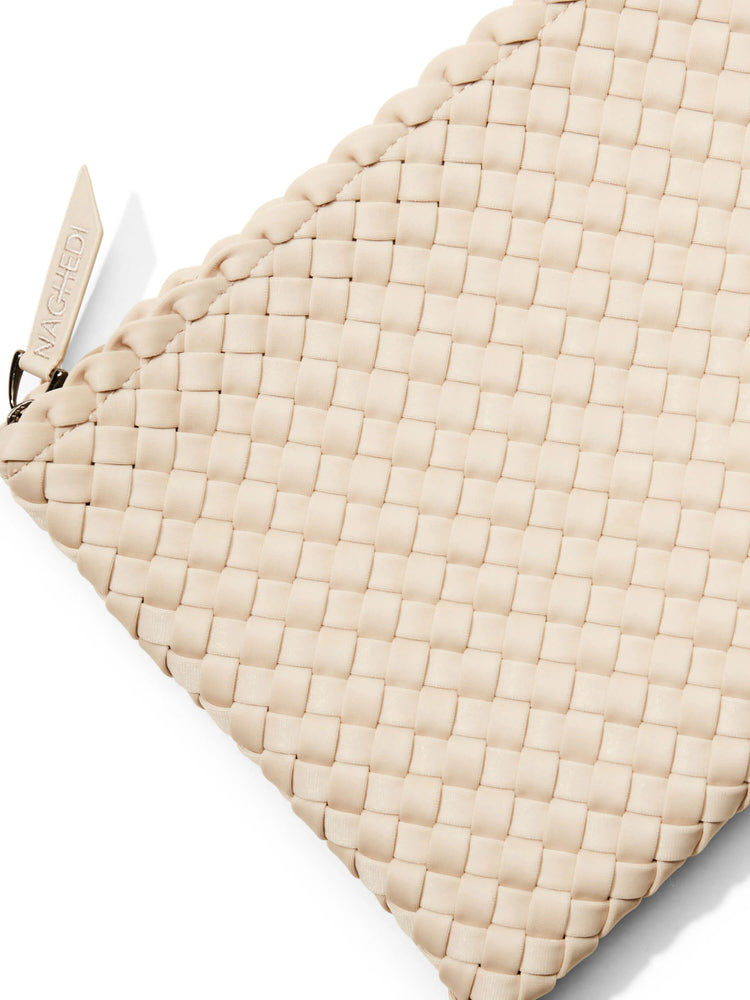 Beige woven tote bag with a small label.  The weave is a tight, square pattern.