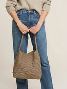 Taupe medium hobo bag with a woven body and braided handle.