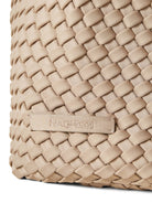 Beige woven hobo bag.  "Naghedi" label visible. Close-up shows woven texture.