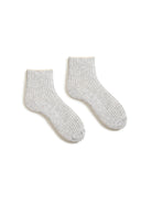 A pair of light gray ribbed shortie socks with beige tips, laid flat.