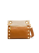 Small tan pebbled leather crossbody bag with a cream top flap, gold zipper, decorative side studs, and top rings.