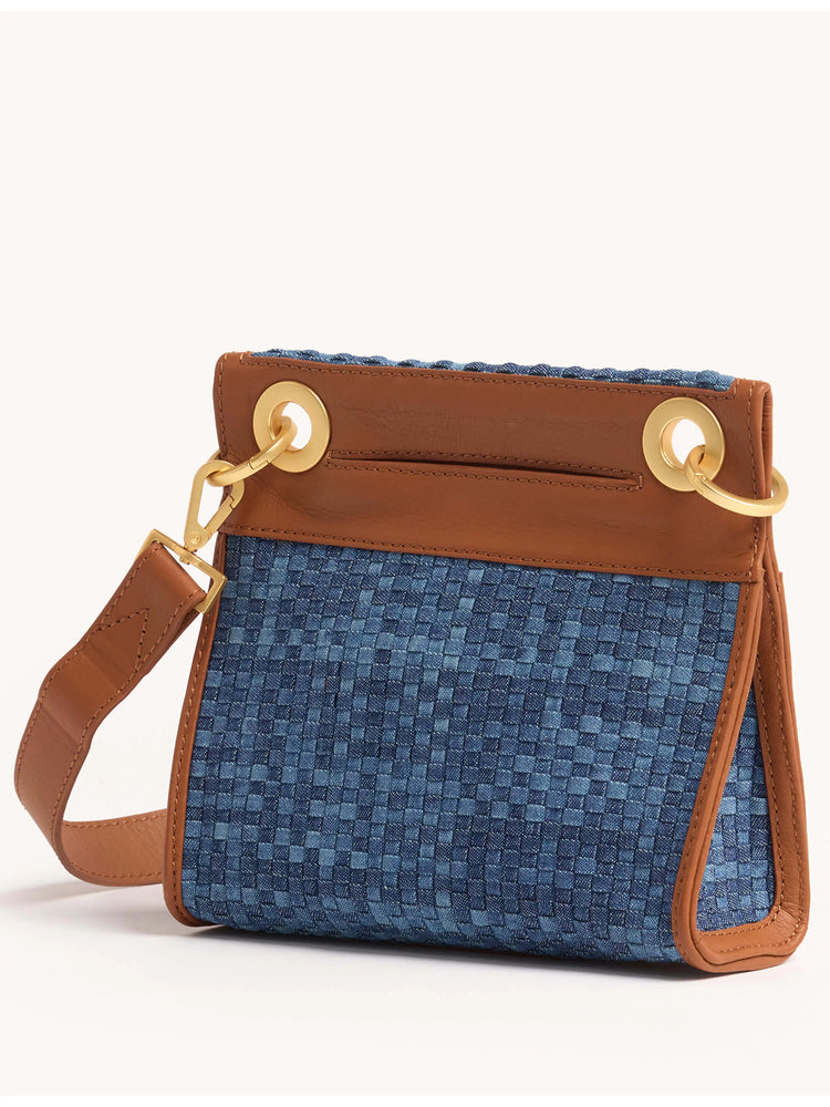 Small blue woven clutch with tan leather trim and strap; gold-toned hardware.