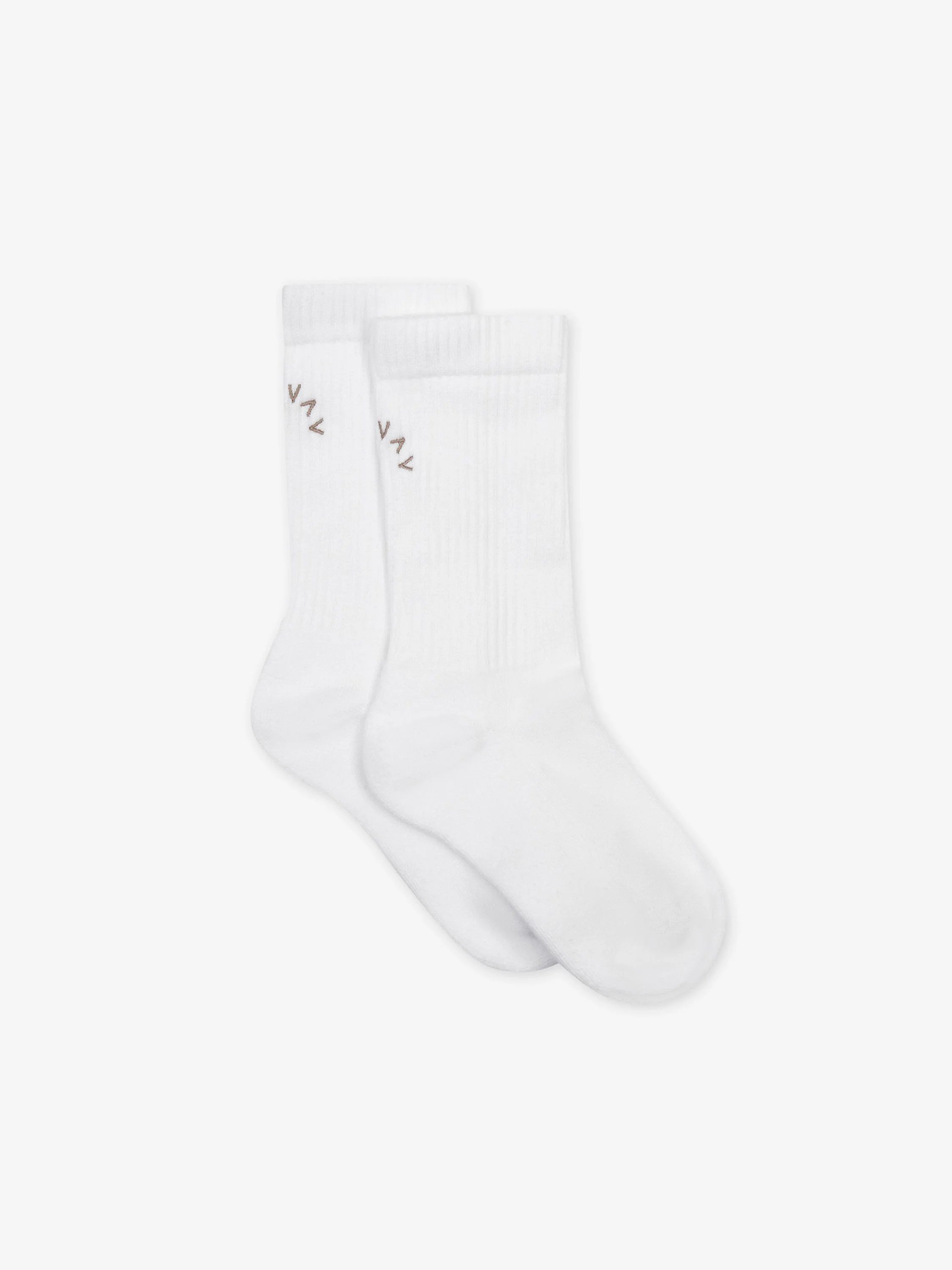 Pair of white crew socks, with a light brown embroidered 'VAL' logo on the ribbed cuff of each sock.