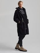 Black Varley Jones Coat: Textured fleece, mid-length, with an inner puffer layer and white drawstring.