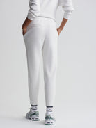 Comfortable light gray tapered sweatpants with rear welt pockets and an elastic waist detail.