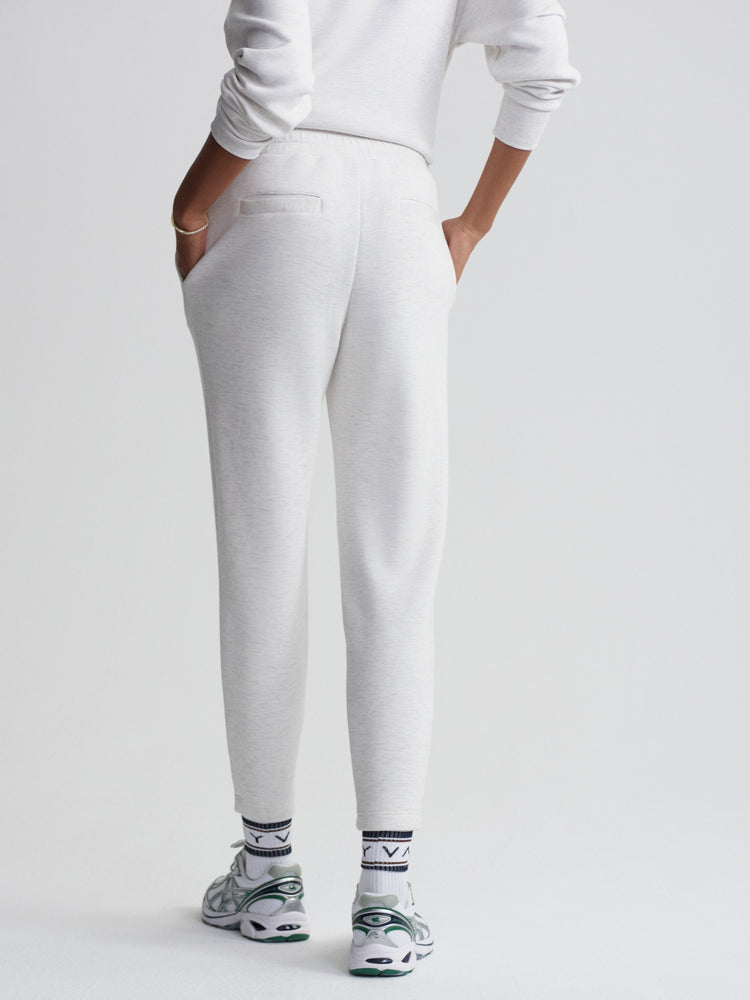 Comfortable light gray tapered sweatpants with rear welt pockets and an elastic waist detail.