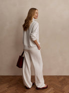 Marled light gray wide-leg pants. Relaxed fit, full length, with pockets.