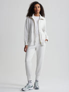 Off-white zip-through jacket with gold zipper.  Features ribbed cuffs and pockets.
