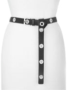 Black belt with silver buckle and numerous silver grommets. A section with grommets hangs vertically.