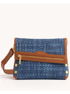 Blue basketweave handbag with tan leather trim, gold front zipper, studs, and a shoulder strap.