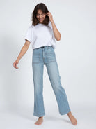 Light blue, wide-leg jeans with front pockets; raw hem.