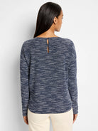 Indigo and white speckled long-sleeve knit top; keyhole back detail.