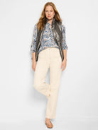 Gunmetal gray puffer vest.  Zipper front. Model wears it over a blue, brown, and white patterned shirt.