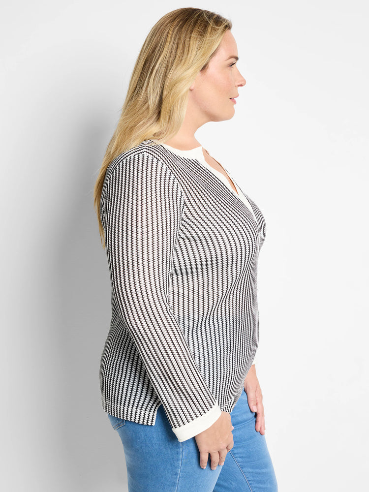 Black and white vertical striped knit top with split neckline and long sleeves.  Off-white trim at neckline and cuffs.