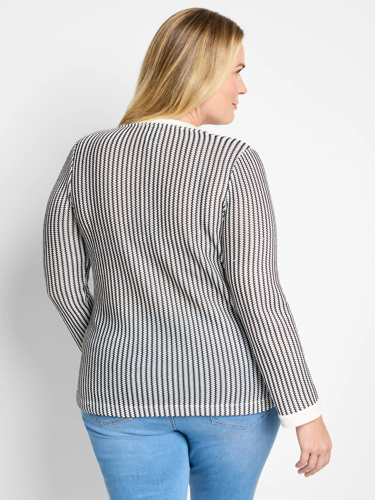 Black and white vertically striped knit top with long sleeves and a split neckline; off-white trim at cuffs.