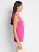 Bright pink ribbed scoop neck tank top, shown on a model.