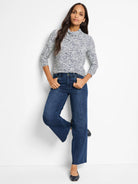 Off-white top with dark blue speckles, cowl neck, three-quarter sleeves.