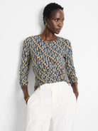 Vintage batik drape top.  Navy, beige, and white abstract print.  Three-quarter sleeves, round neck.