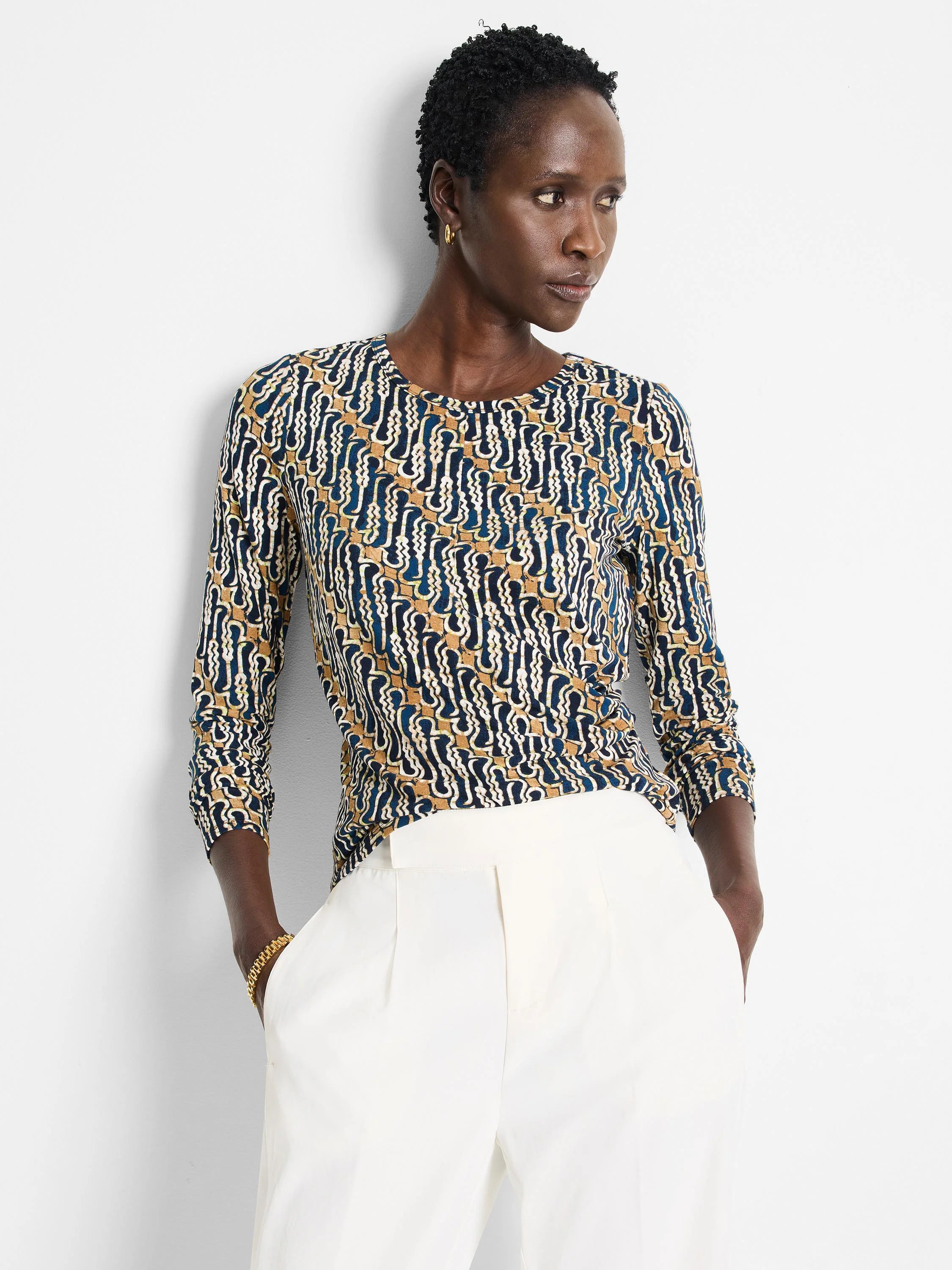 Vintage batik drape top.  Navy, beige, and white abstract print.  Three-quarter sleeves, round neck.
