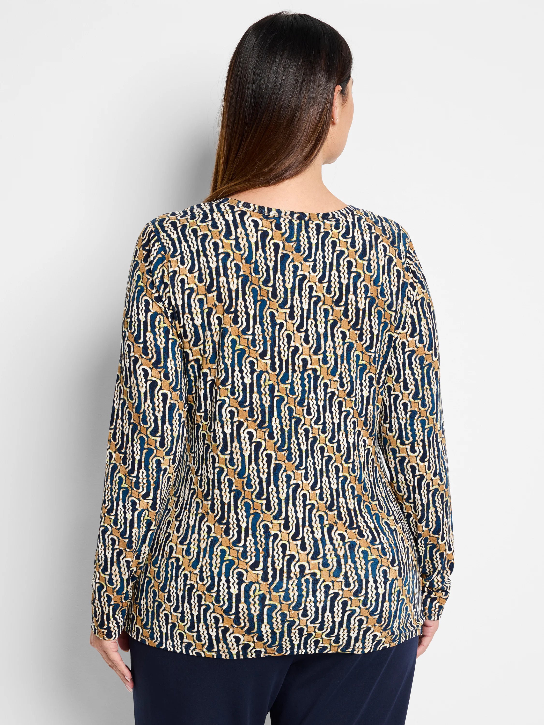 Here's alt text for the image, following your specifications:

"Long-sleeve drape top.  Blue, tan, and white batik...