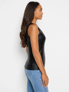 Black ribbed sleeveless tank top; subtle sheen.  Side profile view.