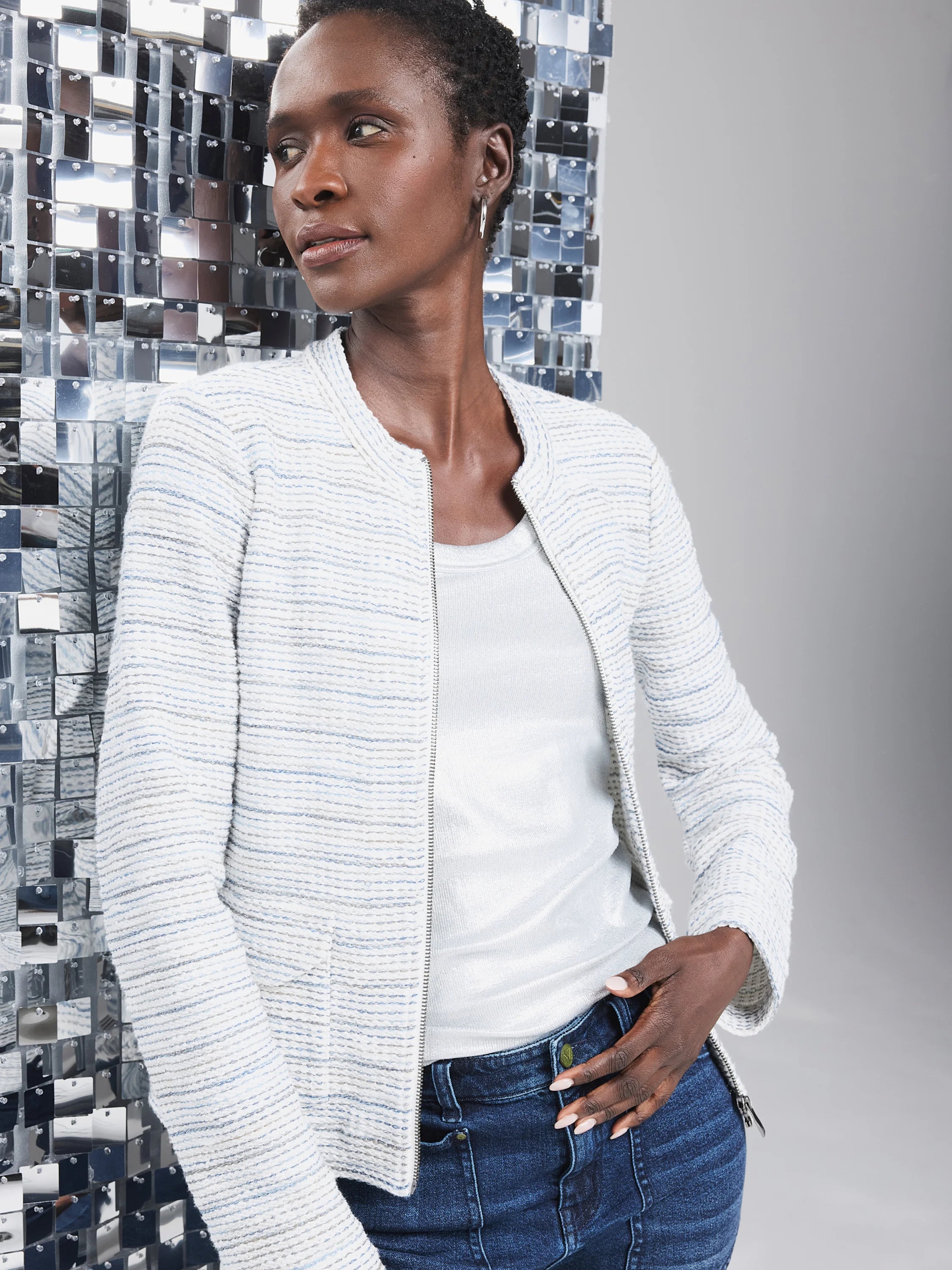 Knit jacket in off-white with thin blue and gray stripes;  zipper front.