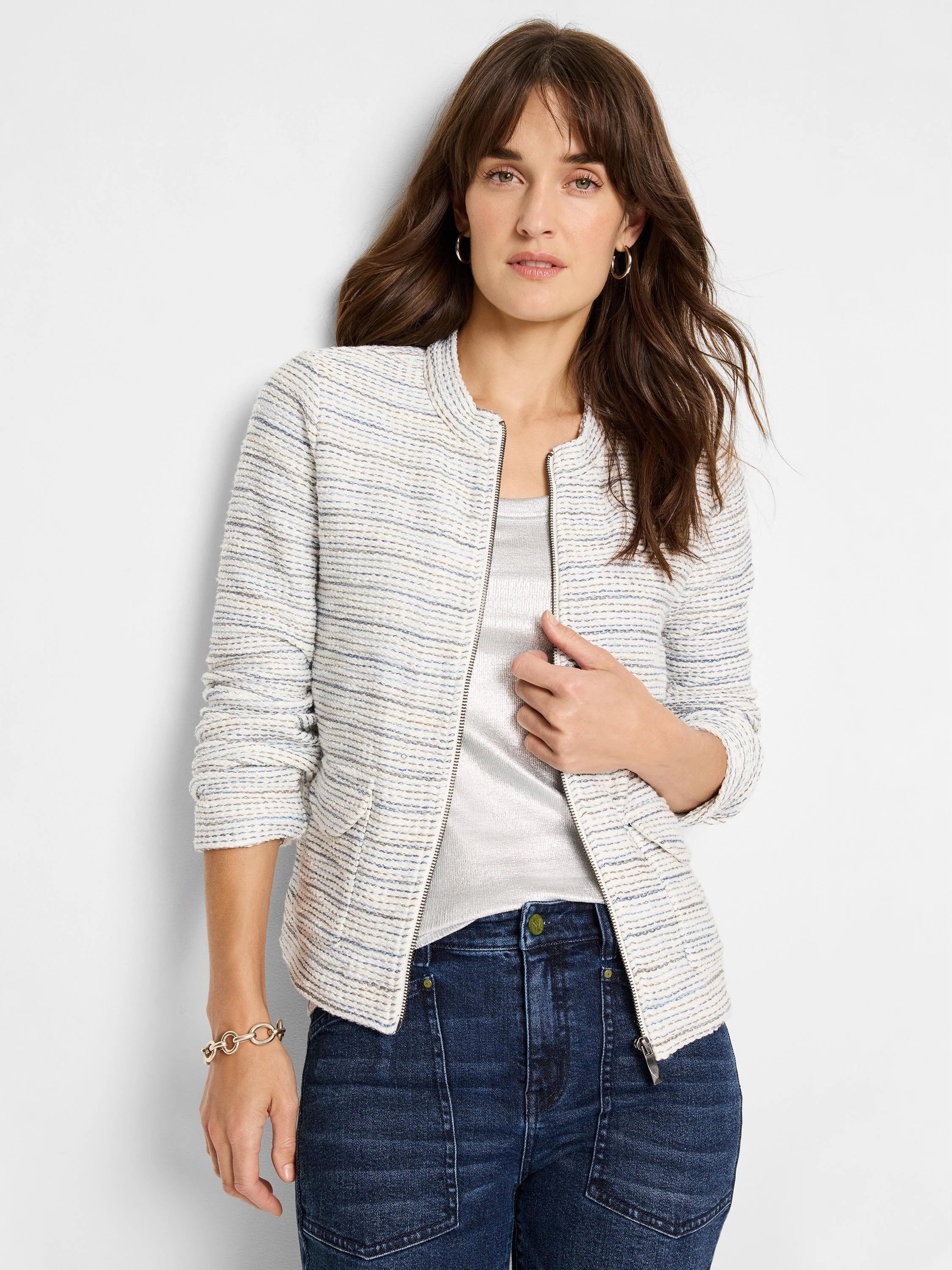 Off-white knit jacket with thin blue and brown stripes, zipper front, and long sleeves.