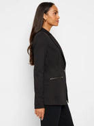 Black zip-front jacket, single button closure, side zip detail.