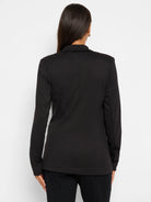 Black zip-up jacket, long sleeves, notched collar.  Rear view.