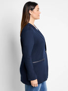 Navy blue zip-front jacket, single button.  Side zip pocket detail.