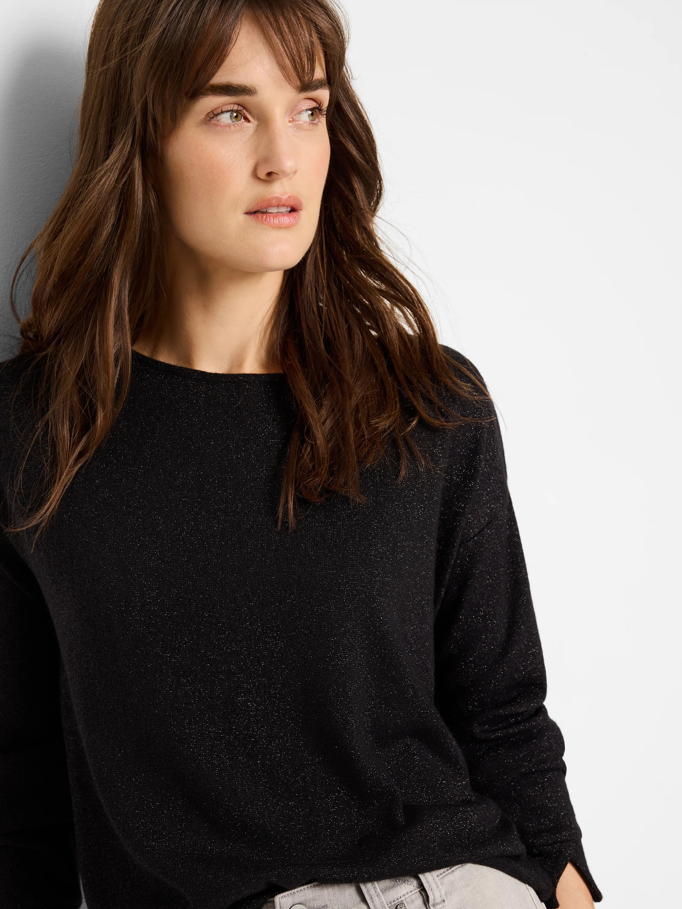 Black sparkly top with 3/4 sleeves and round neckline.