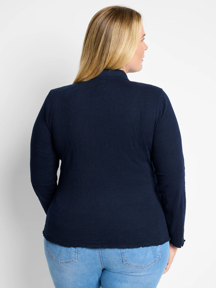 Navy blue collared lace knit top, back view. Long sleeves and a scalloped hem.