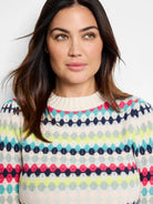 Waffle-knit sweater with horizontal stripes in pink, teal, green, and navy on a cream background.  Fair isle pattern.