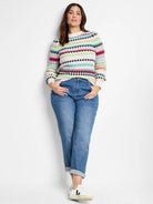 Cream waffle-knit sweater with horizontal stripes in teal, pink, lime, navy.  Features a round neckline and long sleeves.