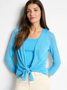 Bright blue sheer knit cardigan with long sleeves and ribbed cuffs, styled tied at the front.