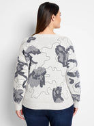 Light gray sweater with a dark gray abstract pattern.  The pattern resembles camouflage.