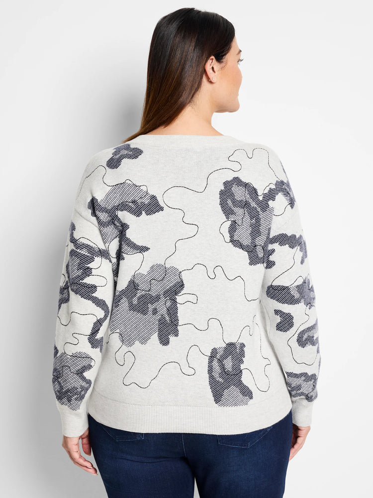 Light gray sweater with a dark gray abstract pattern.  The pattern resembles camouflage.
