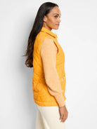 Mustard yellow quilted puffer vest.  Sleeveless, with a collared neckline and small buttons.