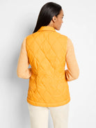 Mustard yellow quilted puffer vest, diamond pattern.  Back view.