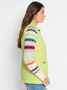 Lime green quilted puffer vest.  Features a diamond pattern and visible knit trim.